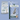 Two Arden Grange dog food packages on an pale blue background, demonstrating the recent change in packaging.