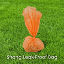 Orange 'Bags On Board' patterned waste pick-up bag on a grass backdrop with text 'Strong leak-proof bag'. 