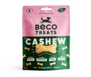 White background with a packet of Beco Dog Treats pictured. On the packet is an illustrated silhouette of a running dog. Text on the pack reads, 'Beco Treats, Cashew' with a picture of a bone shaped treat, text below reads 'Pumpkin seed & Carrot, Tail Waggingly Tasty.'  