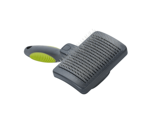 BUSTER Self-cleaning Slicker - Hard Pins Small upwards on a white 