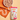 Calibra Life Adult Beef with Rice wet dog food pouch shown next to a bowl of wet dog food on an orange patterned cloth against a warm beige background.
