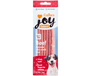 Calibra Joy Salami Beef dog treats in a retail package, featuring a white and red packet with a photo of a dog and a clear window showing the pinkish-beef sticks inside.