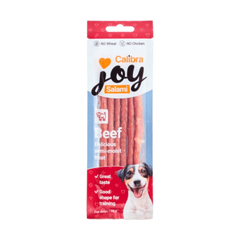 Calibra Joy Salami Beef dog treats in a retail package, featuring a white and red packet with a photo of a dog and a clear window showing the pinkish-beef sticks inside.