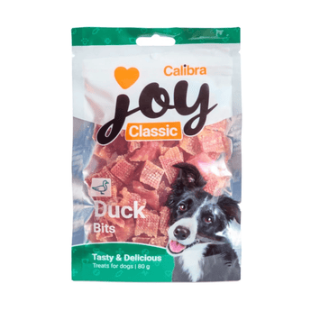 A package of Calibra Joy Classic Duck Bits dog treats, featuring a white and green bag with a picture of a black and white dog on the front, set against a plain white background.