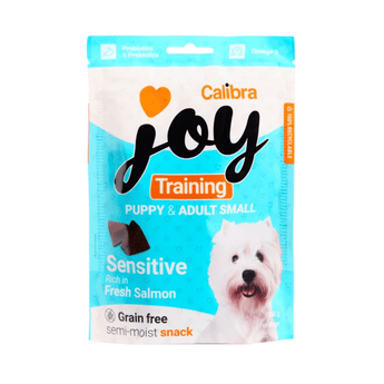 A packet of Calibra Joy Training Puppy & Small Adult dog treats, featuring a west highland terrier on the packaging against a white background.