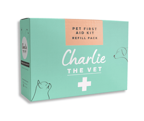 White background with a green box of a Charlie the Vet Pet First Aid Kit Refill Pack, on the box is an illustrated cat and dog. 