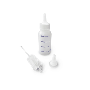 White background with a CVET nursing bottle with a brush and cap in front of the bottle.