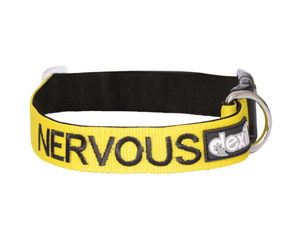 White background with an yellow Dexil collar with the word 'Nervous' stitched in black.