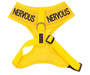 White background with a Dexil yellow dog vest harness with 'Nervous' embroidered twice on the top part. 