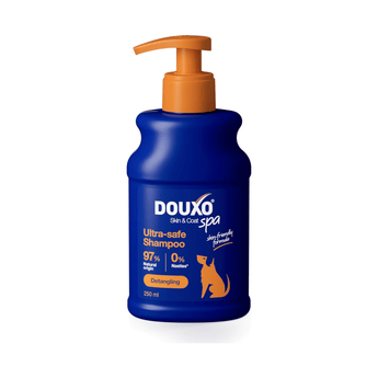 White background with a blue bottle of Douxo Ultra-safe Detangling Shampoo with orange pump. 