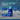 Blue tiled background with a blue bottle of Douxo Ultra-safe Odour Control shampoo with aqua blue pump.  Text above states 'A spa-like experience for pets and their parents!' Below are blue boxes with white text 'Curved bottle design for good grip, even with wet hands, An easy to use one-handed pump, A hypoallergenic coco-vanilla fragrance.' 