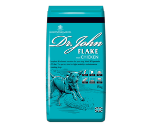 White background with an blue bag of Dr.John Flake with Chicken dry food. Pictured on the bag is an illustrated Labrador dog in a farm field. 