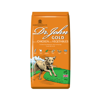 White background with a orange bag of Dr.John Gold Chicken and Vegetables dry food. Pictured on the bag is an illustrated Labrador dog in a farm field. 