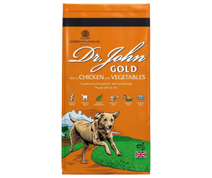 White background with a orange bag of Dr.John Gold Chicken and Vegetables dry food. Pictured on the bag is an illustrated Labrador dog in a farm field. 