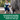 Picture of a woman in blue dungarees and a white t-shirt, knelt down next to a brown and white collie type type dog on a lead. The woman has a green tie handled Earth Rated poop bag in her hand. Text below read 'convenient handles to keep your hand clean on-the-go'. 