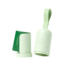 White background with light green Earth Rated poop bag dispenser. The lid is separated from the base showing the roll of bags inside. 