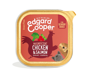 White background with a tray of Edgard and Cooper wet dog food pictured. Text on the foil of the tray says 'Magnificent Chicken & Salmon, broccoli, cranberry.'