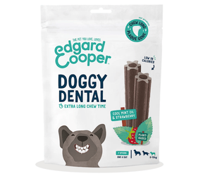 White background with a packet of Edgard & Cooper Doggy Dental Sticks pictured. On the packet is an illustrated French Bulldog with a teethy grin. Text on the pack reads, 'Edgard & Cooper, Doggy Dental, Extra Long Chew Time' with a picture of a stick treat to the right, text next to it reads 'Cool Mint Oil & Strawberry. Plant based.'  