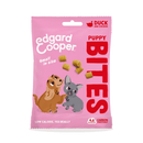 White background with an pink packet of Edgard & Cooper Puppy Bites Duck and Chicken pictured. On the packet is an illustrated French Bulldog and Cocker Spaniel puppy. Text on the pack reads, 'Edgard & Cooper, Puppy Bites, Duck and Chicken. Low calorie, yes really.'
