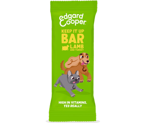 White background with an green packet of Edgard & Cooper Keep it Up Lamb & Turkey Bar pictured. On the packet is an illustrated French Bulldog and Cocker Spaniel. Text on the pack reads, 'Edgard & Cooper, Keep it Up Bar,  Lamb & Turkey. High in Vitamins, yes really.'
