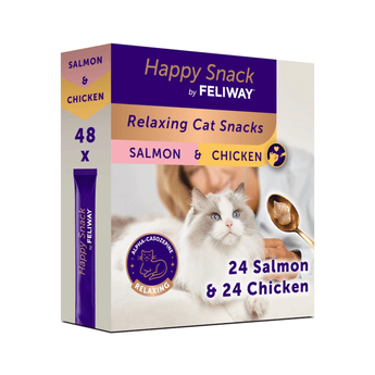 A box of Feliway Happy Snack Relaxing Cat Snacks, Salmon & Chicken flavor, containing 48 pieces. The packaging features a purple and white design with a photo of a white cat on the front, a gold spoon with wet food, and a blue circular seal indicating 'Alpha-Casozepine Relaxing'.