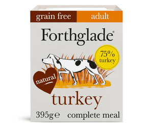 A box of Forthglade adult grain-free turkey dog food, 395g, featuring a white box with brown, orange, and yellow accents, and an illustration of a black and white dog.