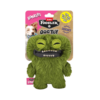 A Bonkers Fuggler dog toy, a green furry monster plush with a wide open mouth showing white teeth, attached to its original retail packaging card.