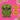 A green furry monster dog toy with large round eyes, a wide grin showing white teeth, and black stitched details, set against a bright pink background with torn paper edges and brick corners. Yellow text boxes on the right read 'BONKERS FUGGLER DOG TOY,' 'THE VIRAL TOY.