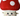 White background with a close up of a large Happy Pet mushroom dog toy with a stitched smiley face and red and white cap.
