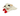 A medium Happy Pet Lamb Chop plush sheep dog toy lying down, featuring cream-colored wool, a white face, red hooves, and black embroidered eyes on a plain white background.
