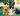 Garden environment with a German Shepherd dog with two Happy Pet brown highland Cows, one brown jumbo and one small white cow.
