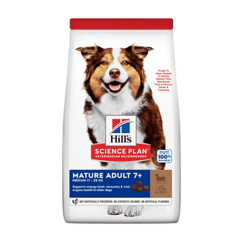 Hills Science Plan dry dog food packaged in a white bag with an adult brown and white collie dog pictured on the bag. Text on bag say 'Hill's Science Plan, veterinarian recommended' and 'Mature Adult 7+, Medium 11kg - 25kg' with a sheep pictured with text 'with lamb & rice' beneath on white background. 