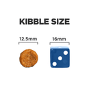 Dog kibble pictured next to a blue dice with text above 'Kibble size.' '12.5mm' is shown above kibble, '16mm' shown above the dice. 