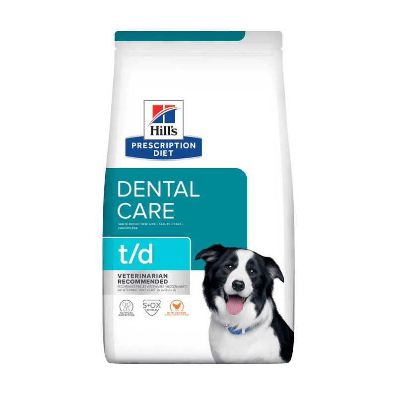 Hills Prescription Diet Dental Care T/D dry dog food packaged in a white bag with an adult black and white collie dog pictured on the bag. Text on bag says 'Hill's Prescription Diet, Dental Care' and 'T/D, Veterinarian recommended' pictured on white background. 