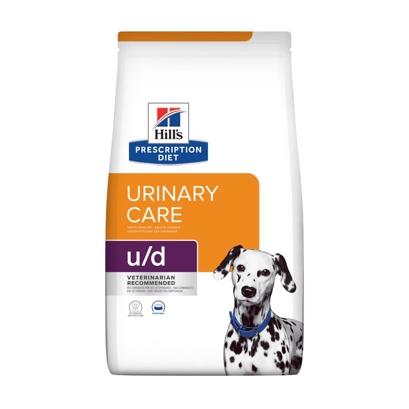Hills Prescription Diet Urinary Care dry dog food packaged in a white bag with an adult Dalmatian dog pictured on the bag. Text on bag says 'Hill's Prescription Diet, Urinary Care' and 'U/D, Veterinarian recommended' pictured on white background. 