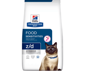 Hills Prescription Diet Z/D Food Sensitivities dry cat food packaged in a white bag with an adult Siamese cat pictured on the bag. Text on bag says 'Hill's Prescription Diet, Food Sensitivities' and 'Z/D, Veterinarian recommended' pictured on white background. 