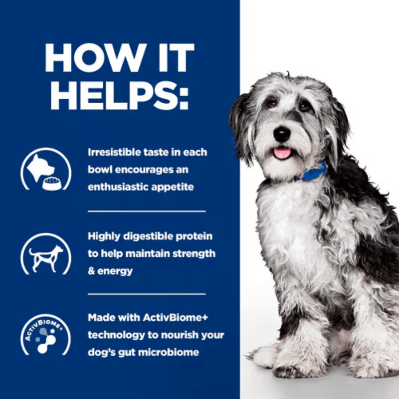 Picture of an adult black and white dog pictured next to a blue section with white text stating 'How it helps: Irresistible taste in each bowl encourages an enthusiastic appetite, Highly digestive protein to help maintain strength & energy, Made with ActivBiome+ technology to nourish your dog's gut microbiome'. 