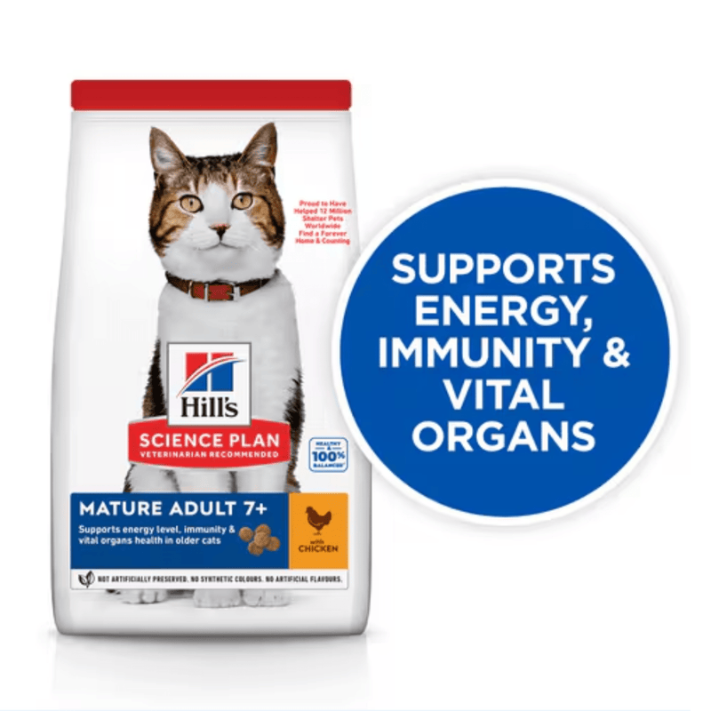 Hills Science Plan cat dry food packaged in a white bag with an adult tabby and white cat pictured on the bag. Text on bag say 'Hill's Science Plan, veterinarian recommended' and 'Mature Adult 7+' with a chicken pictured with text 'with chicken' beneath on white background. Large blue circle pictured over the side of the bag with white text saying 'Supports energy immunity & vital organs'. 