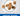 Seven dog kibbles pictured in a circle with text below 'Kibble size approx. 4x7.5mm' and a blue banner with white text 'Great Taste'. 