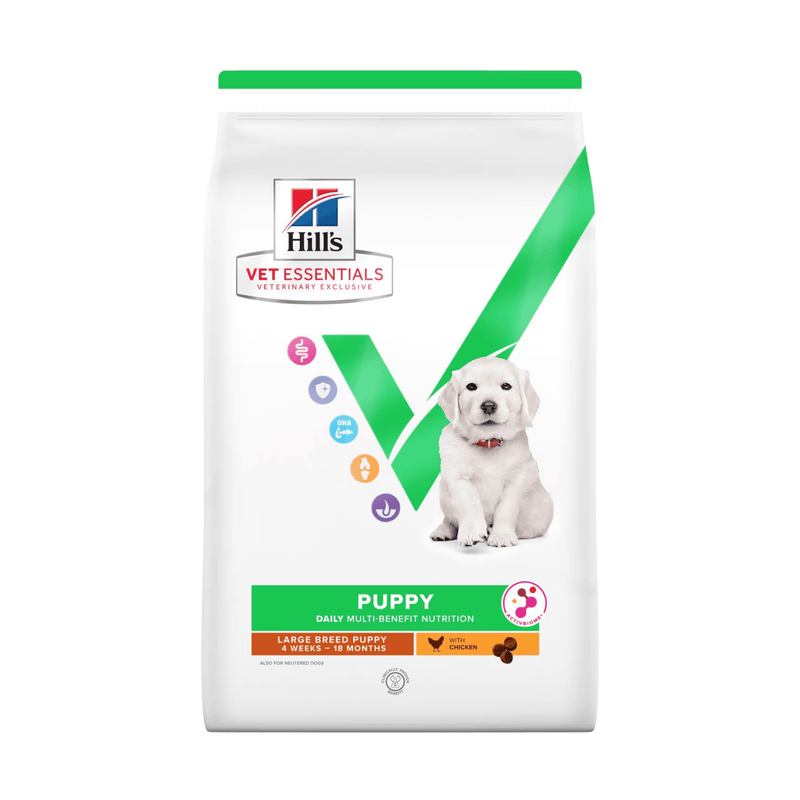Hills Vet Essentials dry puppy food packaged in a white bag with a Golden Labrador puppy pictured on the bag. Text on bag says 'Hill's Vet Essentials, veterinary exclusive' and 'Puppy, Large Breed, 4 weeks - 18months' with a chicken pictured with text 'with Chicken' beneath on white background. 