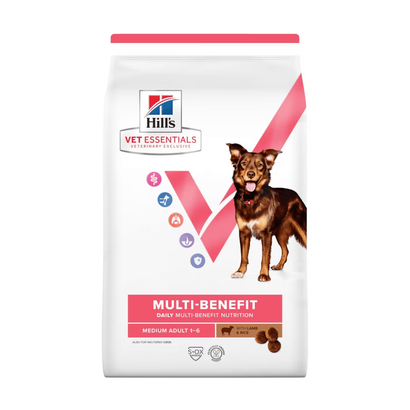 Hills Vet Essentials dry dog food packaged in a white bag with an adult brown and tan collie-type dog pictured on the bag. Text on bag says 'Hill's Vet Essentials, veterinary exclusive' and 'Medium Adult 1 -6' with a sheep pictured with text 'with Lamb & Rice' beneath on white background. 