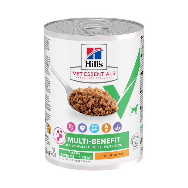 Hills Vet Essentials dog tin with a spoon full of food pictured on the label, text reads 'Multi-Benefit, Puppy 4 weeks - 1 year' and 'Tender Chicken' on a white background. 