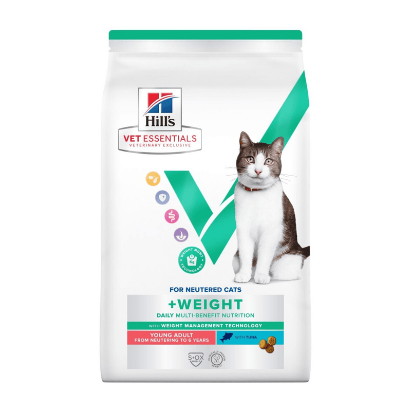 Hills Vet Essentials dry cat food packaged in a white bag with an adult tabby and white cat pictured on the bag. Text on bag says 'Hill's Vet Essentials, veterinary exclusive' and '+Weight, Young Adult, from neutering to 6 years' with a fish pictured with text 'with Tuna' beneath on white background. 