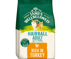White background with a bag of James Wellbeloved Hairball Turkey Cat Food. Packaging is green and cream with 2 cats pictured, with text 'Hairball Adult, 1-7years, Rich in Turkey'. 