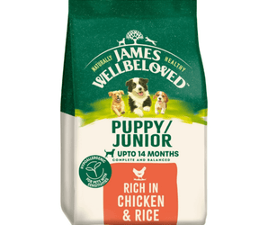 White background with a bag of James Wellbeloved Chicken & Rice Puppy/Junior Food. Packaging is green and cream with 3 puppies pictured, with text 'Puppy/Junior ,Upto 14 months, Rich in Chicken & Rice'. 