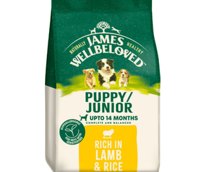 White background with a bag of James Wellbeloved Lamb & Rice Puppy/Junior Food. Packaging is green and cream with 3 puppies pictured, with text 'Puppy/Junior ,Upto 14 months, Rich in Lamb & Rice'. 