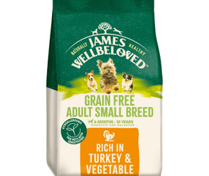 White background with a bag of James Wellbeloved Grain Free Turkey & Vegetable Small Adult Dog Food. Packaging is green and cream with 3 dogs pictured, with text 'Grain Free Adult Small Breed, 6 months - 10 years, Rich in Turkey and Vegetables'. 
