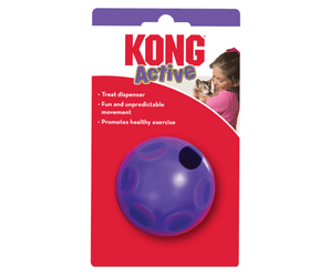 White background with a purple KONG Active Treat Ball for cats attached to a cardboard tag, pictured on the tag is a girl holding a kitten.