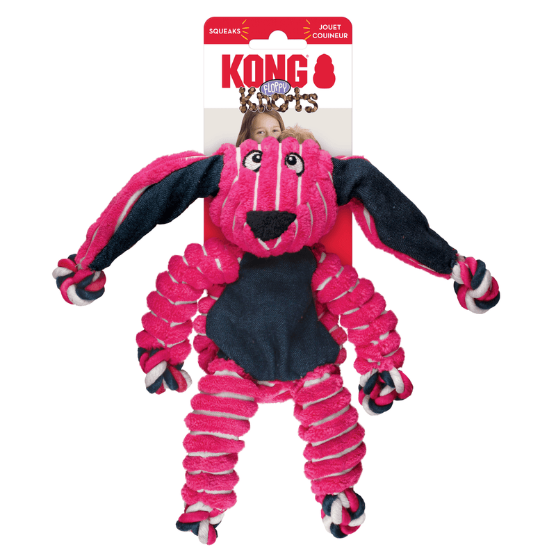 Pink and white stripy fabric Rabbit Dog Toy with dark blue fabric ears and belly attached to a cardboard backing, pictured on a white background. 