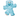 Fluffy blue teddy bear cat toy with stitched eye details and beige nose pictured on a white background.   